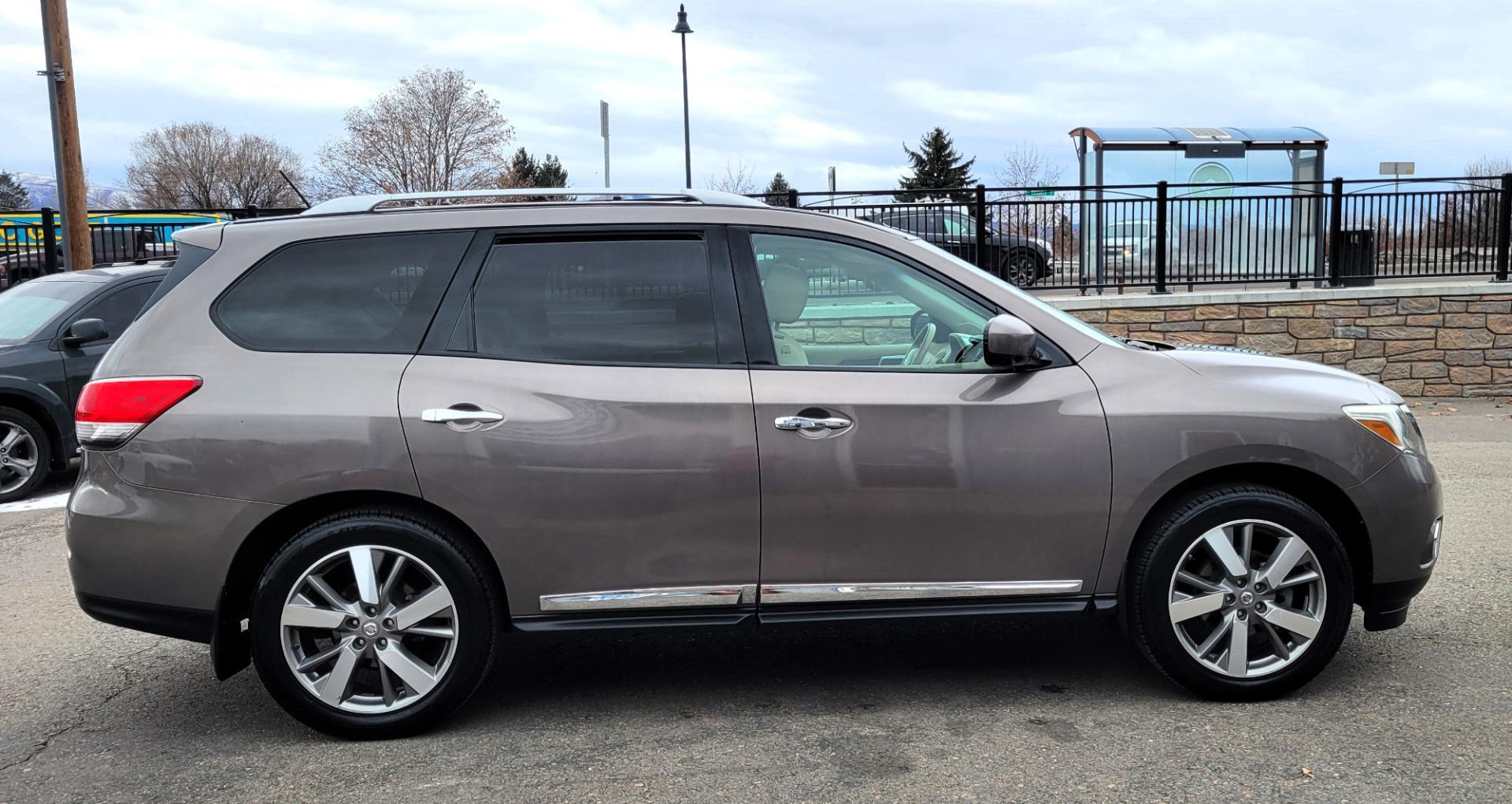 2013 Brown /Tan Nissan Pathfinder Platinum (5N1AR2MM1DC) with an 3.5L V6 engine, Automatic / CVT transmission, located at 450 N Russell, Missoula, MT, 59801, (406) 543-6600, 46.874496, -114.017433 - 4 Wheel Drive SUV. Power Sunroof. 3rd Row Seating. Heated Leather Front and Middle Seats. Power Front Seats. DVD Screens in Headrests. Navigation. Bluetooth. Backup Camera. AM FM CD DVD XM. Heated Steering Wheel. Towing. - Photo#5